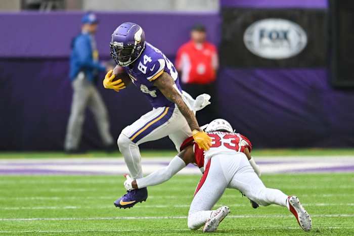 Oct 30, 2022; Minnesota Vikings tight end Irv Smith Jr. (84) avoids the tackle of Arizona Cardinals cornerback Antonio Hamilton (33). Mandatory Credit: Jeffrey Becker-USA TODAY Sports